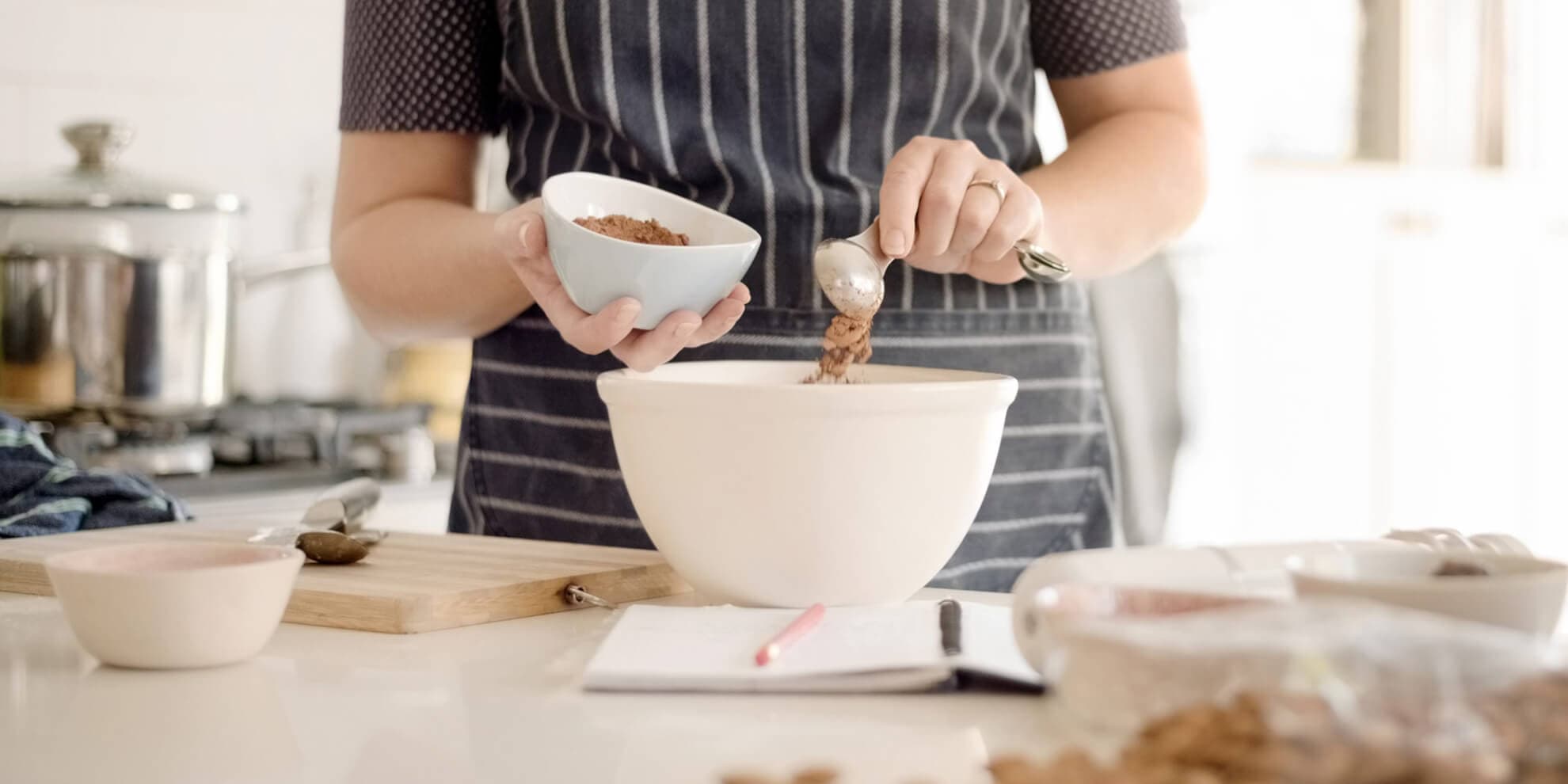 person-mixing-baking-ingredients-in-bowl
